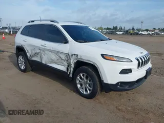 2016 Jeep Cherokee Latitude with VIN 1C4PJMCS1GW185442, listed as a IAAI auction lot 42033699 with 123,306 mi miles. Bid and sale history available at carsss.com. Image 1.