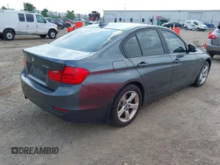 2014 BMW 3 Series 328i xDrive with VIN WBA3B3C55EJ977584, listed as a IAAI auction lot 42805585 with 135,855 mi miles and . Bid and sale history available at DreamBid. Image 4.