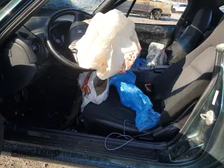 1999 Mazda MX-5 Miata z VIN JM1NB3536X0133733, wystawiony jako Copart lot #50906215 z przebiegiem Nie podano mil oraz Szkoda całkowita • Salvage title. Historia ofert i sprzedaży dostępna na DreamBid. Obrazek 7.