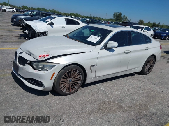 2015 BMW 4 Series 428i with VIN WBA4A5C58FGK15335, listed as a IAAI auction lot 41723243 with 152,652 mi miles and . Bid and sale history available at DreamBid. Image 2.