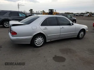 2000 Mercedes-Benz E-Class with VIN WDBJF65J8YB153103, listed as a Copart auction lot 80986234 with 144,205 mi miles and Salvage Title. Bid and sale history available at carsss.com. Image 3.
