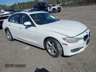 2014 BMW 3 Series 320i with VIN WBA3B1C59EP678908, listed as a IAAI auction lot 41774738 with 143,975 mi miles. Bid and sale history available at carsss.com. Image 1.