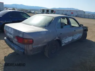1996 Toyota Camry DX with VIN 4T1BG12KXTU655820, listed as a IAAI auction lot 42093458 with 197,247 mi miles. Bid and sale history available at carsss.com. Image 4.