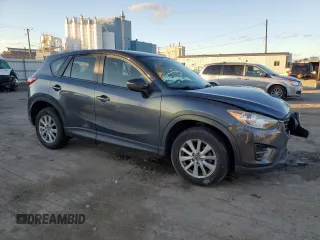 2016 Mazda CX-5 Sport with VIN JM3KE2BY9G0771969, listed as a Copart auction lot 80966064 with 99,348 mi miles and Salvage title. Bid and sale history available at DreamBid. Image 4.