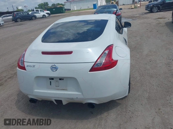 2012 Nissan 370Z z VIN JN1AZ4EH5CM564517, wystawiony jako IAAI lot #42385869 z przebiegiem 55 359 mil mil oraz . Historia ofert i sprzedaży dostępna na DreamBid. Obrazek 17.