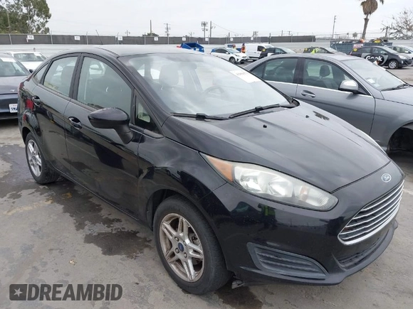 2017 Ford Fiesta SE z VIN 3FADP4BJ7HM145271, wystawiony jako IAAI lot #42056576 z przebiegiem 128 847 mil mil oraz . Historia ofert i sprzedaży dostępna na DreamBid. Obrazek 1.