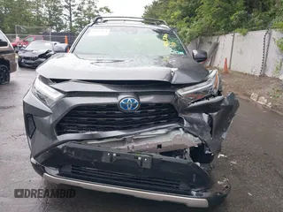 2022 Toyota RAV4 Hybrid SE with VIN JTM16RFV7ND067284, listed as a IAAI auction lot 42637821 with 20,512 mi miles and . Bid and sale history available at DreamBid. Image 6.