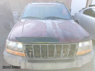 2001 Jeep Grand Cherokee Laredo with VIN 1J4GW48S11C578001, listed as a IAAI auction lot 41671318 with 263,694 mi miles. Bid and sale history available at carsss.com. Image 6.