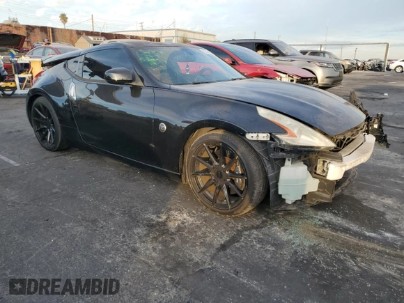 2011 Nissan 370Z Touring with VIN JN1AZ4EH6BM550267, listed as a Copart auction lot 82245804 with 124,466 mi miles and Salvage Title. Bid and sale history available at carsss.com. Image 4.