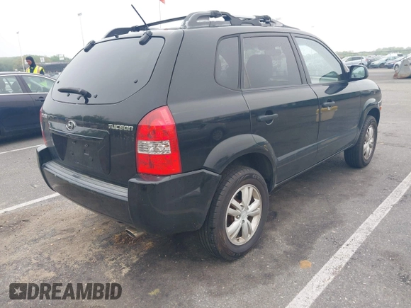 2009 Hyundai Tucson GLS with VIN KM8JM12B59U990027, listed as a IAAI auction lot 42195935 with 170,875 mi miles. Bid and sale history available at carsss.com. Image 4.