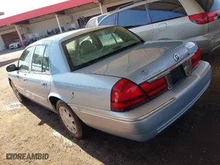 2004 Mercury Grand Marquis GS with VIN 2MEFM74W24X690149, listed as a IAAI auction lot 41842464 with 118,776 mi miles. Bid and sale history available at carsss.com. Image 3.