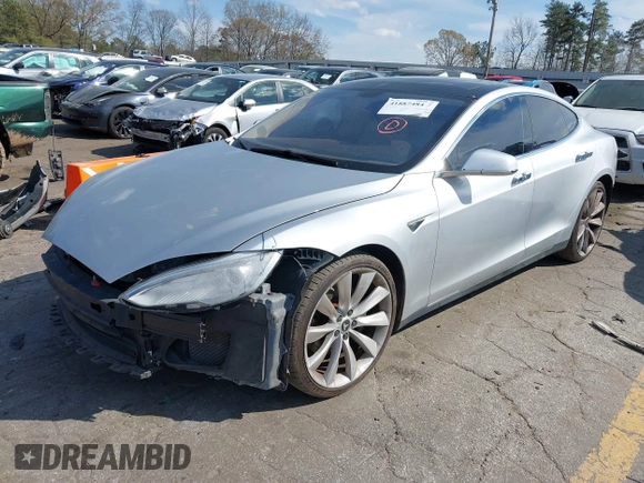 2014 Tesla Model S 60 z VIN 5YJSA1H16EFP28486, wystawiony jako IAAI lot #41887484 z przebiegiem 99 271 mil mil oraz . Historia ofert i sprzedaży dostępna na DreamBid. Obrazek 2.