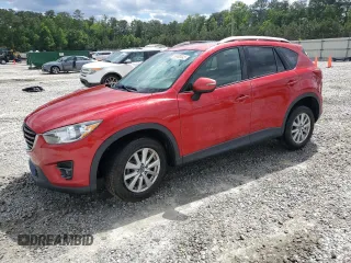 2016 Mazda CX-5 Touring z VIN JM3KE2CY9G0881712, wystawiony jako Copart lot #55490545 z przebiegiem 99 630 mil mil oraz Szkoda całkowita • Salvage title. Historia ofert i sprzedaży dostępna na DreamBid. Obrazek 1.
