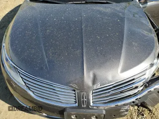 2016 Lincoln MKZ z VIN 3LN6L2JK1GR626675, wystawiony jako Copart lot #56068645 z przebiegiem 94 068 mil mil oraz Szkoda całkowita • Salvage title. Historia ofert i sprzedaży dostępna na DreamBid. Obrazek 11.