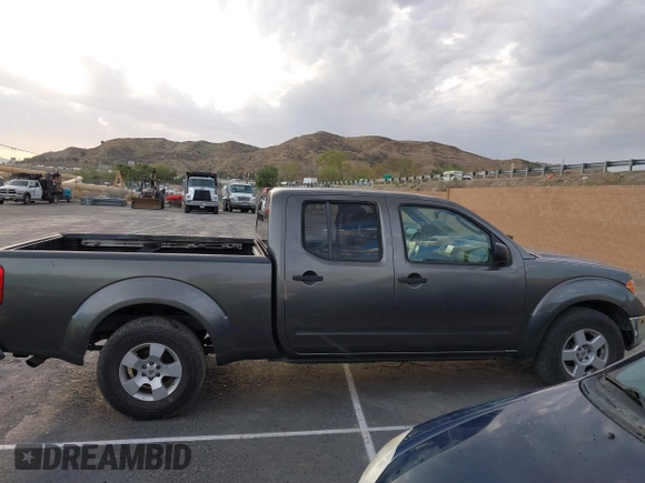 2007 Nissan Frontier SE z VIN 1N6AD09U67C411083, wystawiony jako IAAI lot #41691251 z przebiegiem 186 495 mil mil oraz . Historia ofert i sprzedaży dostępna na DreamBid. Obrazek 13.