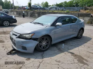 2012 Scion tC z VIN JTKJF5C76C3028941, wystawiony jako Copart lot #60074575 z przebiegiem 167 834 mil mil oraz Szkoda całkowita • Salvage title. Historia ofert i sprzedaży dostępna na DreamBid. Obrazek 1.