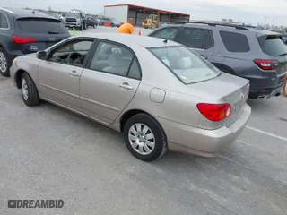 2003 Toyota Corolla CE with VIN 1NXBR32E73Z137535, listed as a IAAI auction lot 42041727 with 243,586 mi miles. Bid and sale history available at carsss.com. Image 3.