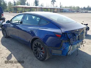 2023 Tesla Model 3 Performance with VIN 5YJ3E1EC2PF679613, listed as a IAAI auction lot 42099199 with 21,721 mi miles. Bid and sale history available at carsss.com. Image 3.