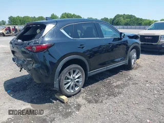 2020 Mazda CX-5 Grand Touring with VIN JM3KFADM9L1837183, listed as a IAAI auction lot 42340628 with 81,975 mi miles and . Bid and sale history available at DreamBid. Image 4.