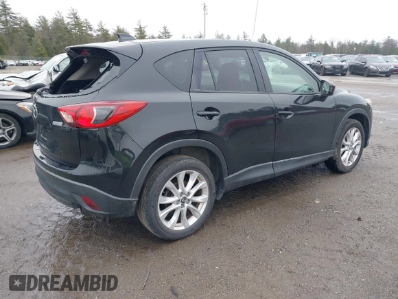 2013 Mazda CX-5 Grand Touring with VIN JM3KE2DEXD0124270, listed as a IAAI auction lot 41942120 with 109,087 mi miles. Bid and sale history available at carsss.com. Image 4.