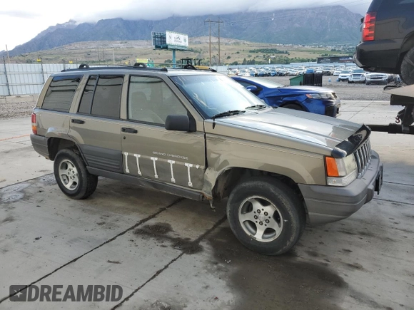 1996 Jeep Grand Cherokee Laredo with VIN 1J4GZ58S3TC245928, listed as a Copart auction lot 57313735 with 165,733 mi miles and Salvage title. Bid and sale history available at DreamBid. Image 4.