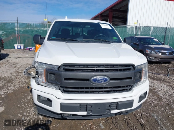 2018 Ford F-150 XL with VIN 1FTEW1E5XJFE20779, listed as a IAAI auction lot 41705616 with 138,996 mi miles and . Bid and sale history available at DreamBid. Image 12.