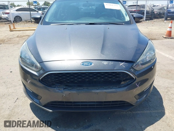 2016 Ford Focus SE z VIN 1FADP3F25GL329217, wystawiony jako IAAI lot #42461772 z przebiegiem 85 070 mil mil oraz . Historia ofert i sprzedaży dostępna na DreamBid. Obrazek 6.