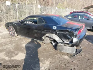 2013 Dodge Challenger SXT with VIN 2C3CDYAG5DH520017, listed as a IAAI auction lot 41882517 with 128,854 mi miles. Bid and sale history available at carsss.com. Image 3.