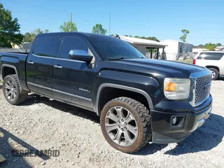 2015 GMC Sierra 1500 Denali z VIN 3GTU2WEJ6FG400004, wystawiony jako IAAI lot #42097356 z przebiegiem 148 544 mil mil oraz . Historia ofert i sprzedaży dostępna na DreamBid. Obrazek 1.