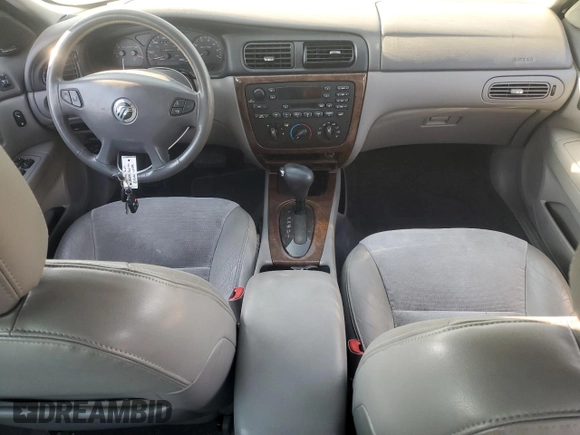 2000 Mercury Sable z VIN 1MEFM53U7YG640279, wystawiony jako Copart lot #70701264 z przebiegiem 118 790 mil mil oraz Szkoda całkowita • Salvage title. Historia ofert i sprzedaży dostępna na DreamBid. Obrazek 8.