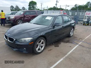 2012 BMW 3 Series 328i with VIN WBA3A5G51CNP17522, listed as a IAAI auction lot 42124868 with 154,385 mi miles and . Bid and sale history available at carsss.com. Image 2.