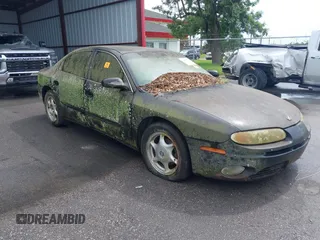 2001 Oldsmobile Aurora z VIN 1G3GS64C814126911, wystawiony jako IAAI lot #42467666 z przebiegiem 200 066 mil mil oraz . Historia ofert i sprzedaży dostępna na DreamBid. Obrazek 1.