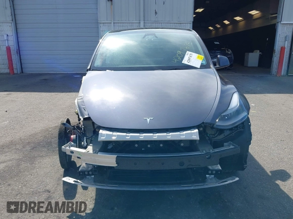 2023 Tesla Model Y Long Range with VIN 7SAYGDEE7PF856985, listed as a IAAI auction lot 42097675 with 13,112 mi miles and . Bid and sale history available at DreamBid. Image 13.