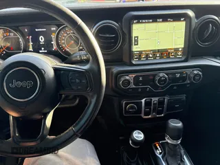 2022 Jeep Gladiator Willys z VIN 1C6HJTAG9NL160131, wystawiony jako Copart lot #50428855 z przebiegiem 56 970 mil mil oraz Czysty tytuł • Clean title. Historia ofert i sprzedaży dostępna na DreamBid. Obrazek 9.