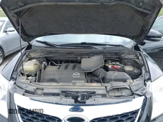 2011 Mazda CX-9 Grand Touring z VIN JM3TB2DAXB0300466, wystawiony jako IAAI lot #41921411 z przebiegiem 196 257 mil mil oraz . Historia ofert i sprzedaży dostępna na DreamBid. Obrazek 10.