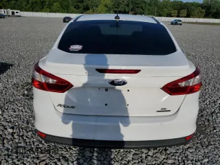 2014 Ford Focus SE with VIN 1FADP3F27EL412368, listed as a Copart auction lot 51463155 with 143,484 mi miles and Salvage Title. Bid and sale history available at DreamBid. Image 6.