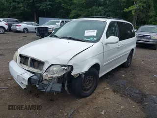 2004 Kia Sedona LX with VIN KNDUP131446493787, listed as a IAAI auction lot 40004348 with 168,374 mi miles. Bid and sale history available at carsss.com. Image 2.
