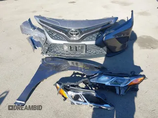 2018 Toyota Camry LE z VIN 4T1B11HK0JU546451, wystawiony jako IAAI lot #41054832 z przebiegiem 35 660 mil mil oraz . Historia ofert i sprzedaży dostępna na DreamBid. Obrazek 12.