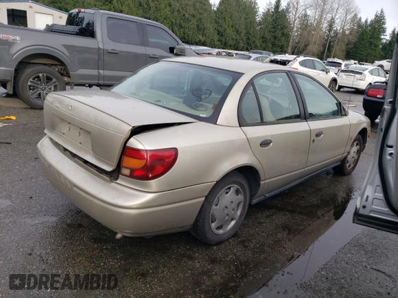 2001 Saturn SL z VIN 1G8ZH52851Z286886, wystawiony jako Copart lot #84883824 z przebiegiem Nie podano mil oraz Szkoda całkowita • Salvage title. Historia ofert i sprzedaży dostępna na DreamBid. Obrazek 3.