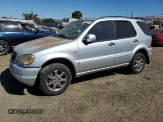 2000 Mercedes-Benz M-Class with VIN 4JGAB72E5YA173269, listed as a Copart auction lot 71520714 with 239,248 mi miles and Clean Title. Bid and sale history available at carsss.com. Image 1.