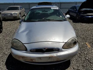1996 Mercury Sable LS z VIN 1MELM53S4TG634577, wystawiony jako Copart lot #61707733 z przebiegiem 76 781 mil mil oraz Szkoda całkowita • Salvage title. Historia ofert i sprzedaży dostępna na DreamBid. Obrazek 5.