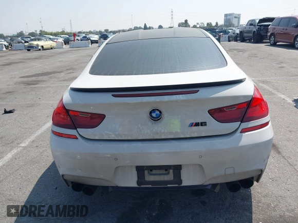 2013 BMW M6 z VIN WBSLX9C52DD159906, wystawiony jako IAAI lot #42095042 z przebiegiem 105 463 mil mil oraz . Historia ofert i sprzedaży dostępna na DreamBid. Obrazek 16.