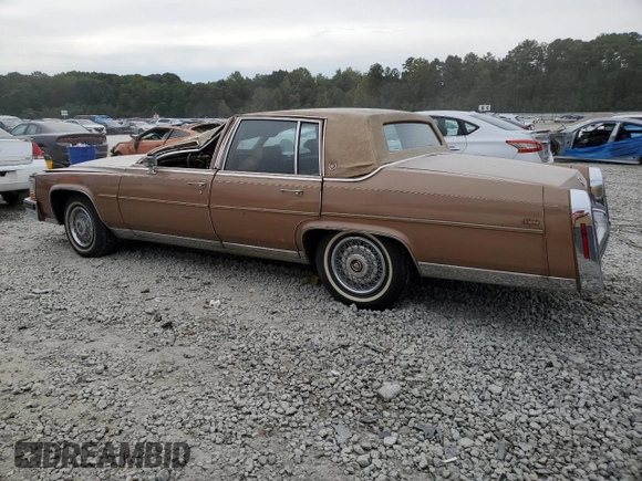 1988 Cadillac Brougham z VIN 1G6DW51Y5J9727006, wystawiony jako Copart lot #70573614 z przebiegiem 34 628 mil mil oraz Szkody całkowita. Historia ofert i sprzedaży dostępna na DreamBid. Obrazek 2.