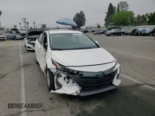 2021 Toyota Prius LE z VIN JTDKAMFP9M3196770, wystawiony jako Copart lot #54309555 z przebiegiem 21 948 mil mil oraz Szkoda całkowita • Salvage title. Historia ofert i sprzedaży dostępna na DreamBid. Obrazek 13.