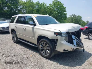 2015 Chevrolet Tahoe LTZ z VIN 1GNSKCKCXFR717576, wystawiony jako IAAI lot #42412691 z przebiegiem 96 922 mil mil oraz . Historia ofert i sprzedaży dostępna na DreamBid. Obrazek 1.