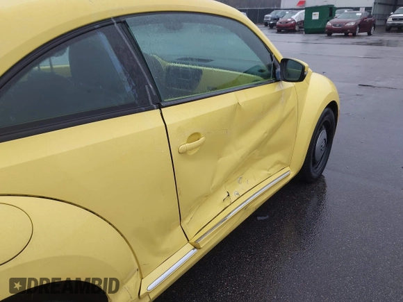 2013 Volkswagen Beetle 2.5L with VIN 3VWHX7AT7DM613197, listed as a IAAI auction lot 41298890 with 130,219 mi miles and . Bid and sale history available at DreamBid. Image 18.