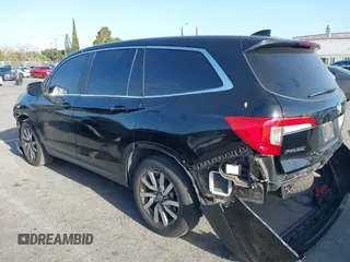 2021 Honda Pilot EX-L with VIN 5FNYF5H5XMB021833, listed as a IAAI auction lot 41935222 with 65,165 mi miles and . Bid and sale history available at carsss.com. Image 14.