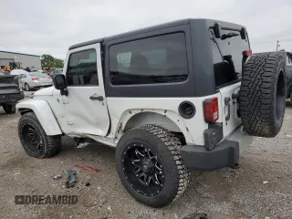 2013 Jeep Wrangler Sahara with VIN 1C4AJWBGXDL579341, listed as a Copart auction lot 55970815 with 105,961 mi miles and Salvage title. Bid and sale history available at DreamBid. Image 2.