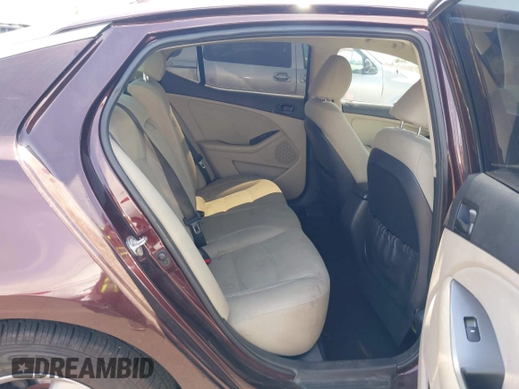 2014 Kia Optima LX with VIN 5XXGM4A77EG303496, listed as a IAAI auction lot 42572421 with 117,151 mi miles and . Bid and sale history available at DreamBid. Image 8.