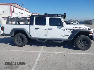 2022 Jeep Gladiator Mojave z VIN 1C6JJTEG0NL103523, wystawiony jako IAAI lot #41842011 z przebiegiem 36 160 mil mil oraz . Historia ofert i sprzedaży dostępna na DreamBid. Obrazek 14.